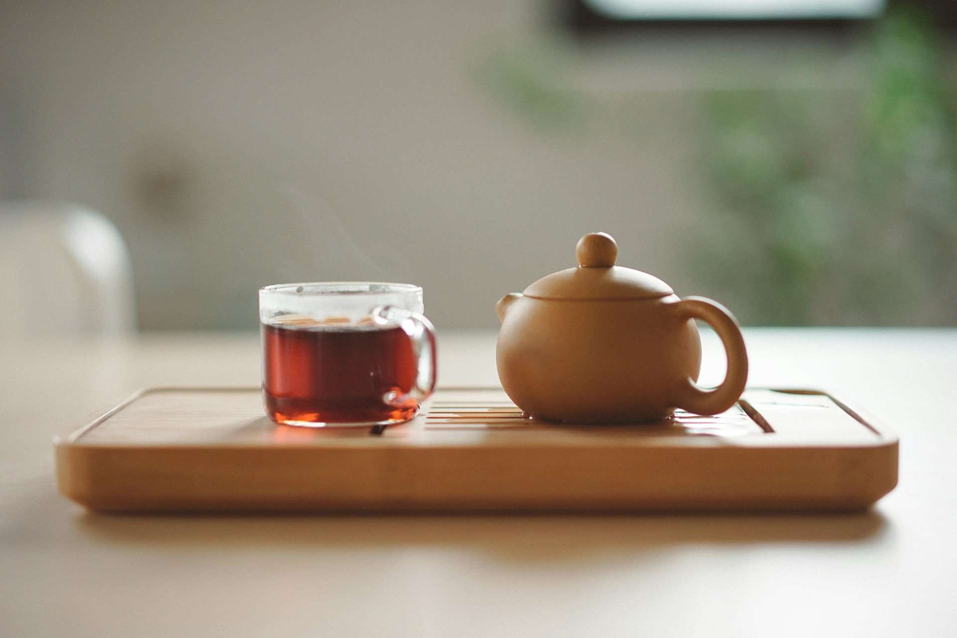 Herbal tea and teapot setup representing holistic wellness and natural health practices