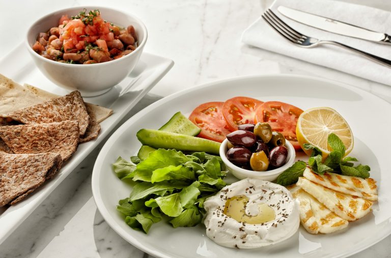 Meals don't have to be boring for you to enjoy the benefits of healthy eating - a plate including veggies, fruit, dairy and more.