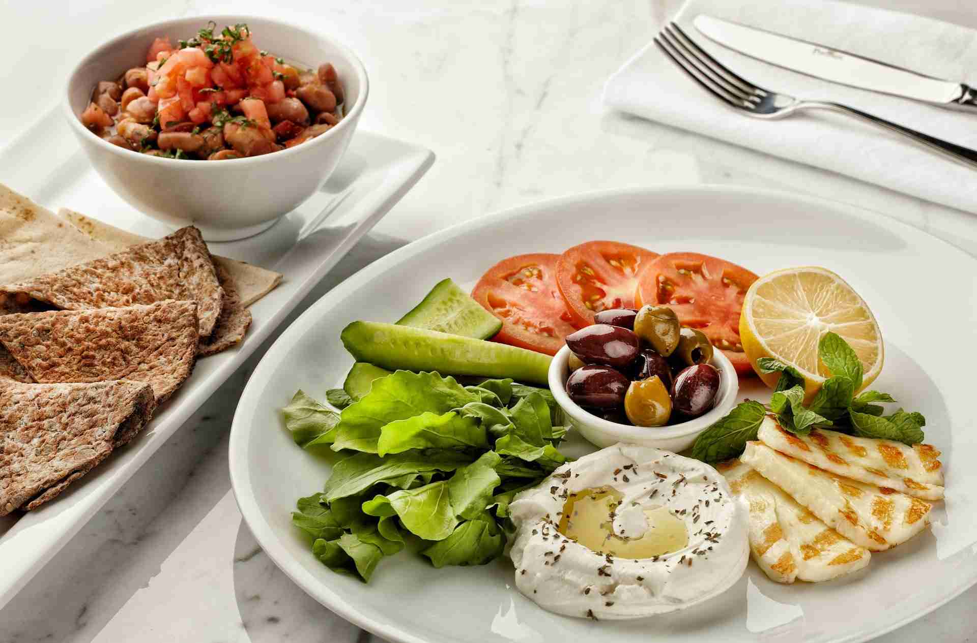 Meals don't have to be boring for you to enjoy the benefits of healthy eating - a plate including veggies, fruit, dairy and more.